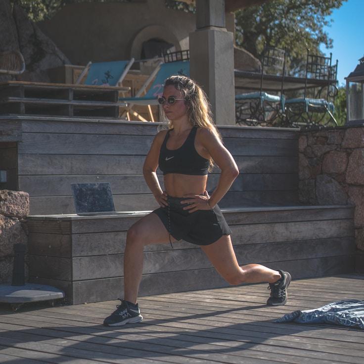 Women in a fitness class doing stretching and mobility exercises